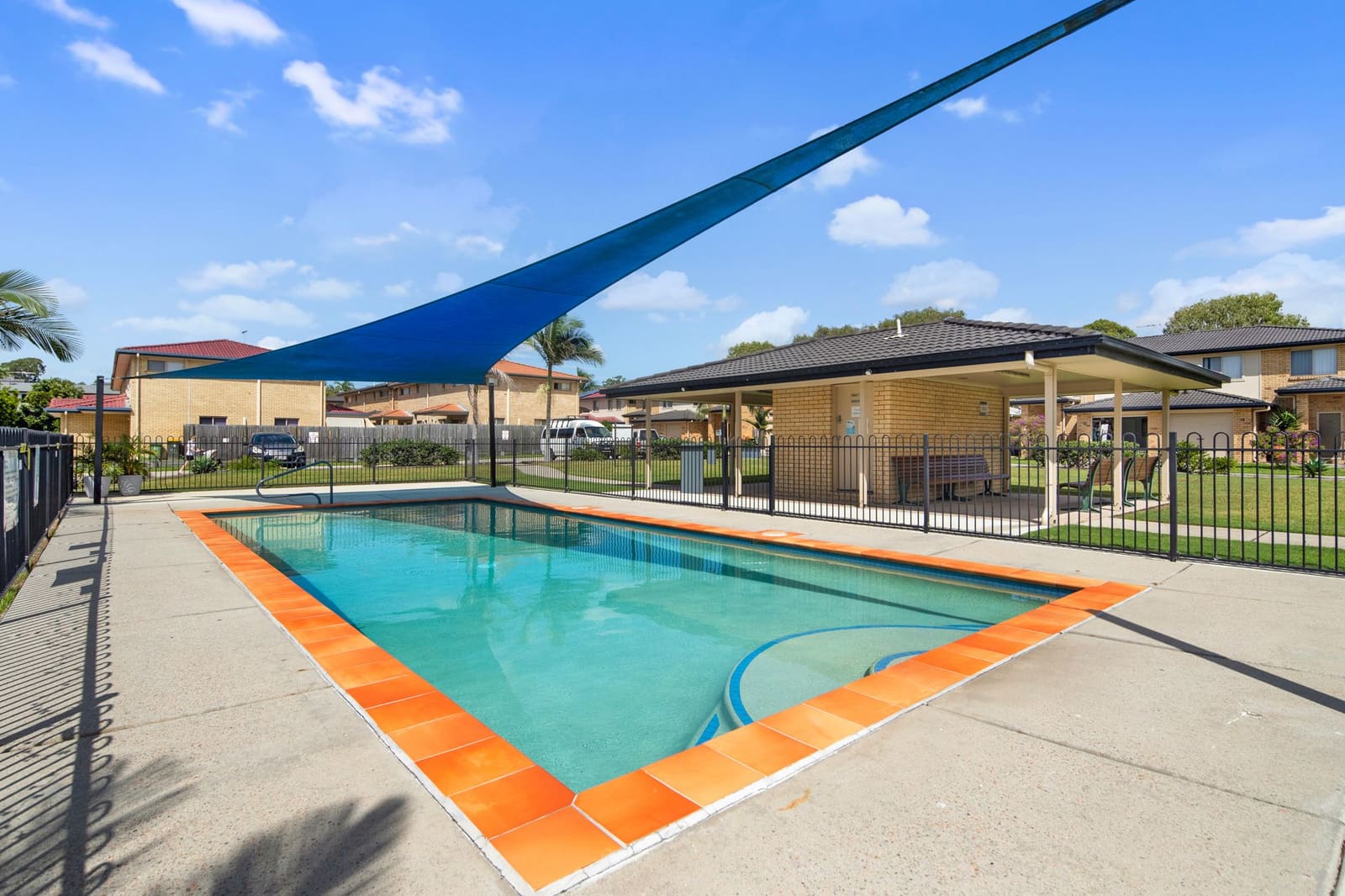 Swimming pool with shade sail